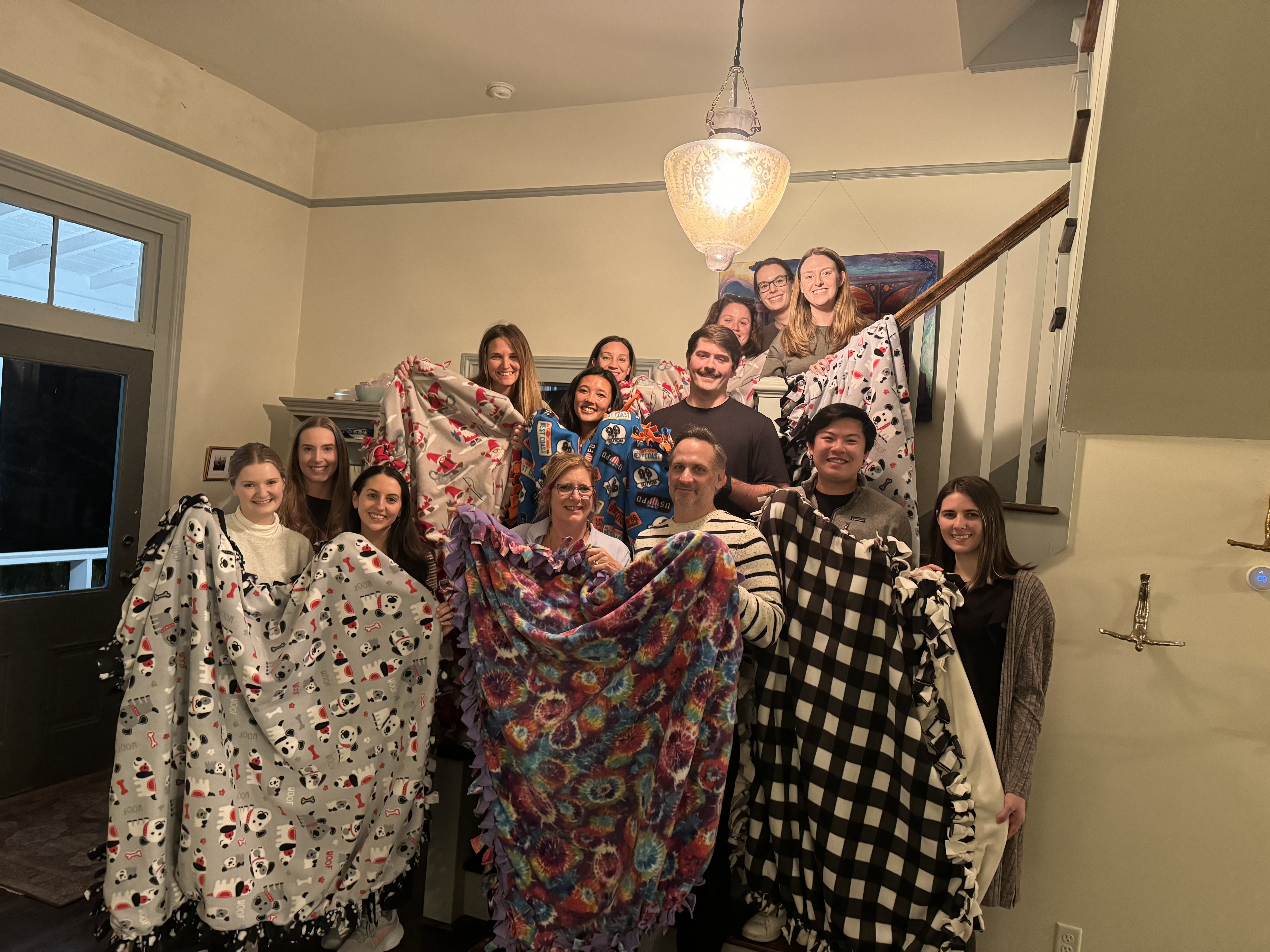 I-O Group holding handmade blankets