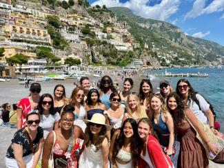 Group shot of students on the beach in Naples.