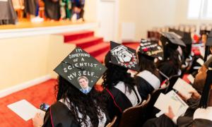IOMP Graduates Listening to Speaker