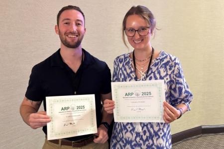 Nate and Leigha pose with certificates