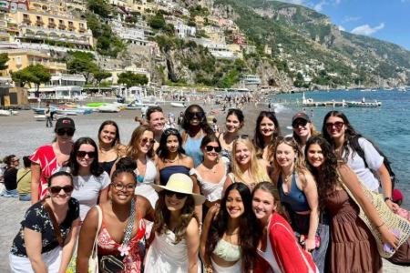 Group shot of students on the beach in Naples.