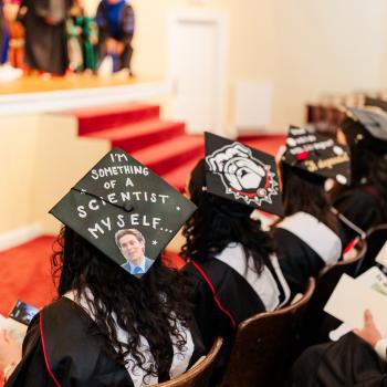 IOMP Graduates Listening to Speaker